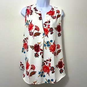 Sleeveless mixed media blouse, split neck. 100% rayon, jersey panel on the back.